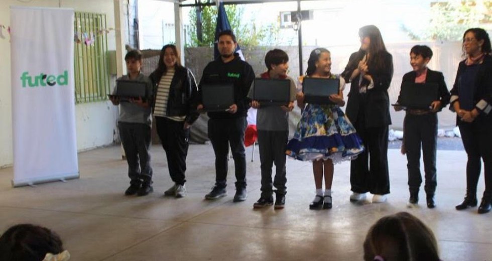 Students working on donated computers in a classroom